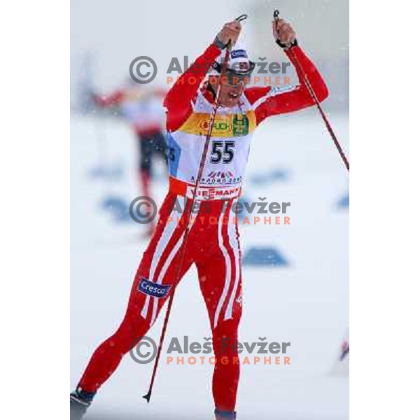 Lars Berger of Norway racing in snow storm at Cross Country 15 km individual race at FIS Nordic Ski WC Sapporo, Japan