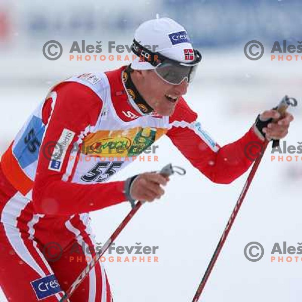 Lars Berger of Norway racing in snow storm at Cross Country 15 km individual race at FIS Nordic Ski WC Sapporo, Japan