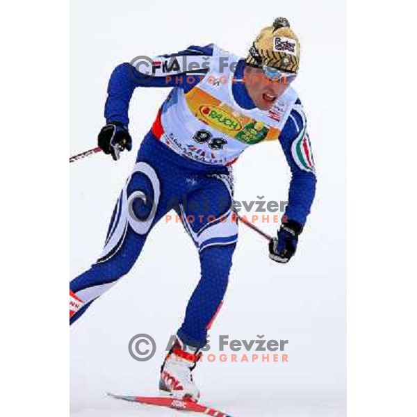 Giorgio Di Centa racing in snow storm at Cross Country 15 km individual race at FIS Nordic Ski WC Sapporo, Japan