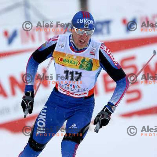 Eugenij Dementiev racing in snow storm at Cross Country 15 km individual race at FIS Nordic Ski WC Sapporo, Japan