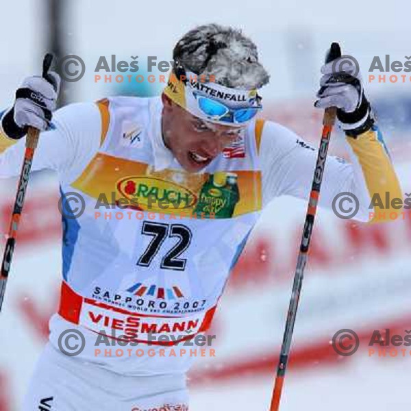 Marcus Hellner racing in snow storm at Cross Country 15 km individual race at FIS Nordic Ski WC Sapporo, Japan