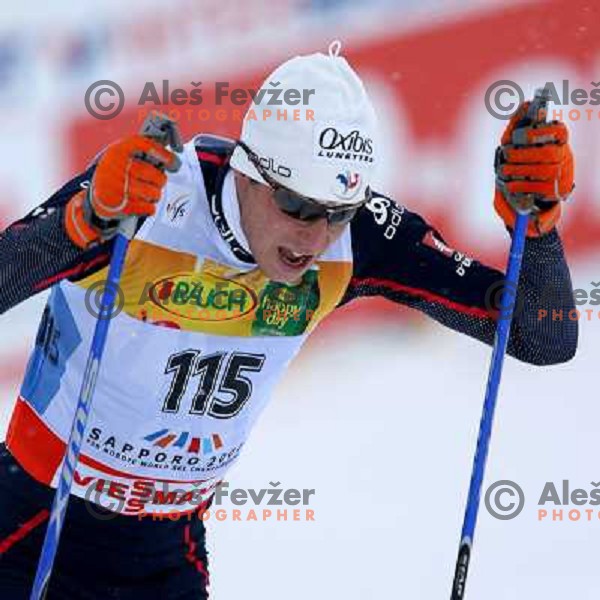 Emmanuel Jonnier racing in snow storm at Cross Country 15 km individual race at FIS Nordic Ski WC Sapporo, Japan