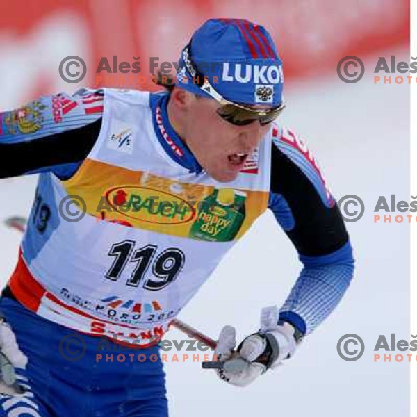 Alexander Legkov racing in snow storm at Cross Country 15 km individual race at FIS Nordic Ski WC Sapporo, Japan