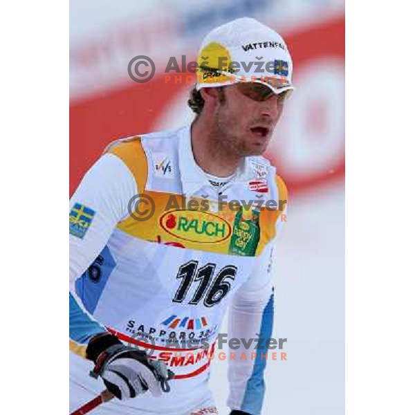 Anders Soedergren racing in snow storm at Cross Country 15 km individual race at FIS Nordic Ski WC Sapporo, Japan