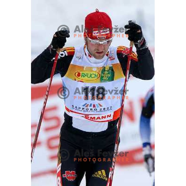 Axel Teichmann racing in snow storm at Cross Country 15 km individual race at FIS Nordic Ski WC Sapporo, Japan