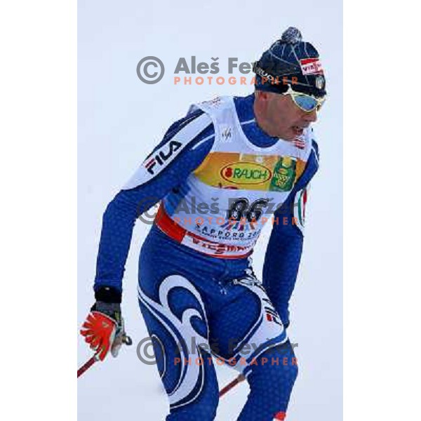 Cristian Zorzi racing in snow storm at Cross Country 15 km individual race at FIS Nordic Ski WC Sapporo, Japan