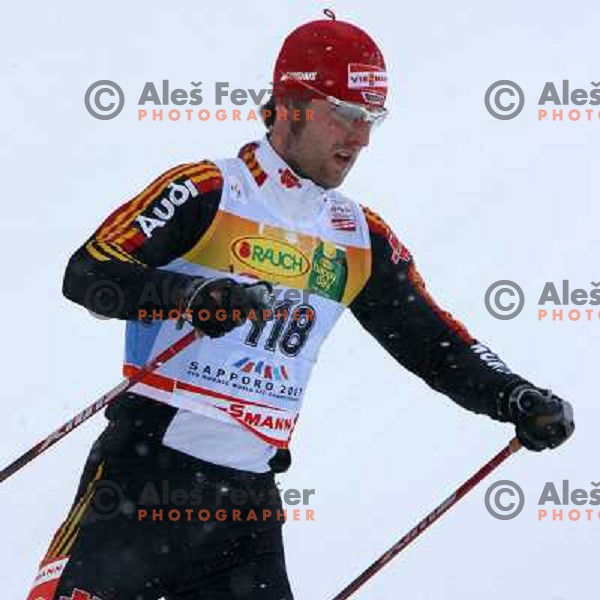 Axel Teichmann racing in snow storm at Cross Country 15 km individual race at FIS Nordic Ski WC Sapporo, Japan