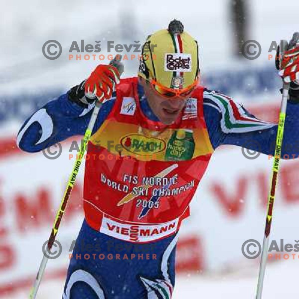 Pietro Piller Cottrer racing in snow storm at Cross Country 15 km individual race at FIS Nordic Ski WC Sapporo, Japan
