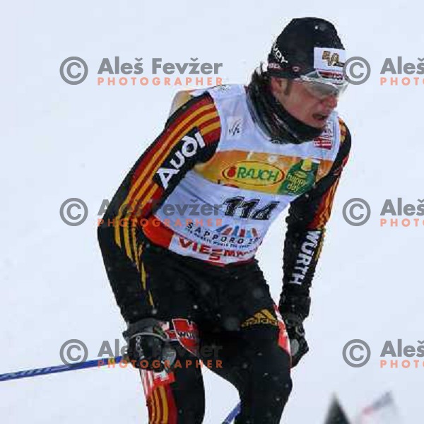 Franz Goering racing in snow storm at Cross Country 15 km individual race at FIS Nordic Ski WC Sapporo, Japan