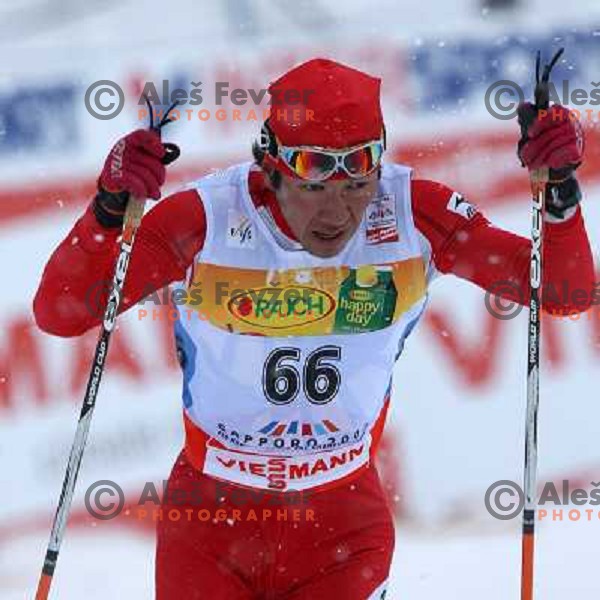 Nobu Naruse racing in snow storm at Cross Country 15 km individual race at FIS Nordic Ski WC Sapporo, Japan
