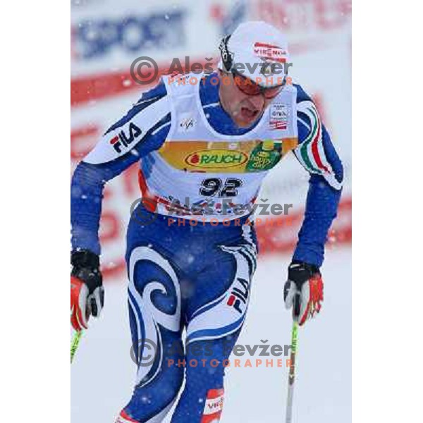 Fabio Santus racing in snow storm at Cross Country 15 km individual race at FIS Nordic Ski WC Sapporo, Japan