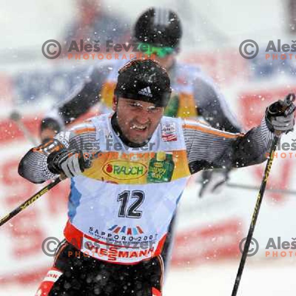 Borce Jovanovski racing in snow storm at Cross Country 15 km individual race at FIS Nordic Ski WC Sapporo, Japan