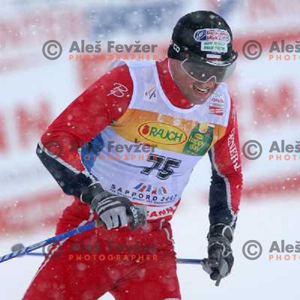 Janusz Krezelok racing in snow storm at Cross Country 15 km individual race at FIS Nordic Ski WC Sapporo, Japan