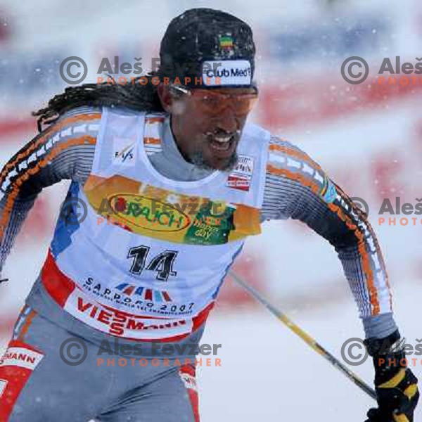 Robel Teklemariam racing in snow storm at Cross Country 15 km individual race at FIS Nordic Ski WC Sapporo, Japan