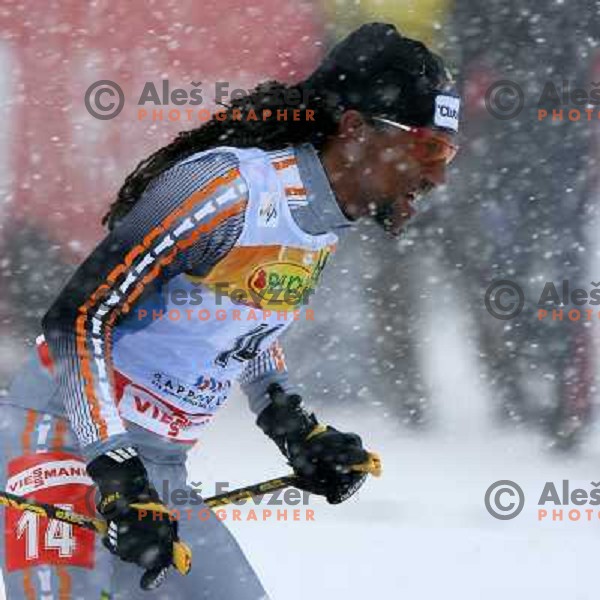 Robel Teklemariam racing in snow storm at Cross Country 15 km individual race at FIS Nordic Ski WC Sapporo, Japan