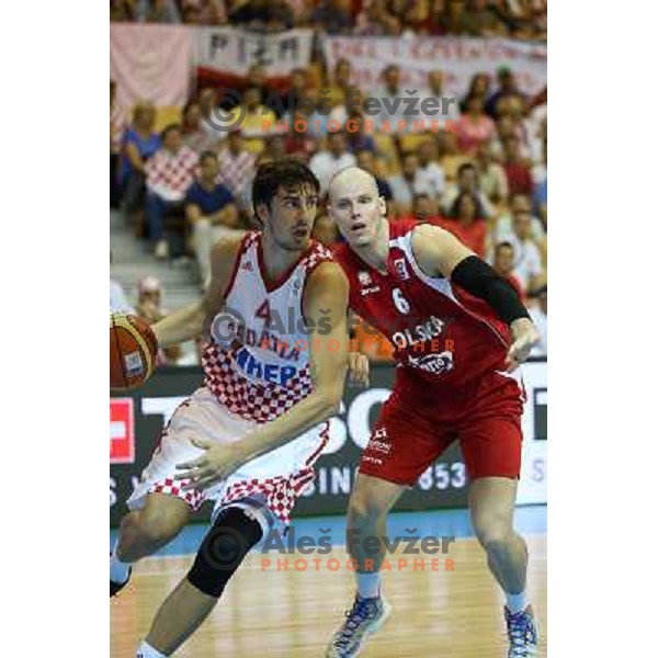 Ante Tomic of Croatia and Maciej Lempe of Poland at basketball match Croatia-Poland in Preliminary round group C of Eurobasket 2013, played in Arena Zlatorog , Celje, Slovenia on September 7, 2013 