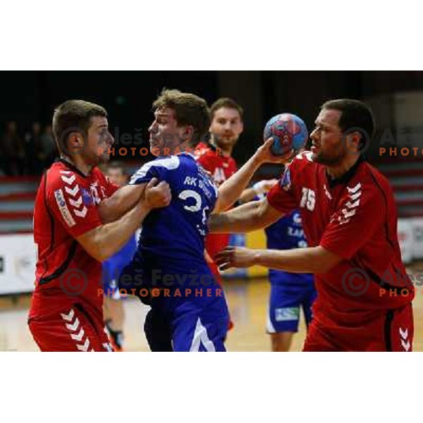 Lucijan Fizuleto of Sevnica and Domen Pogacnik of Slovan in action during handball match between RD Slovan and RK Sevnica, played in Kodeljevo Hall, Ljubljana, Slovenia on October 5, 2013 