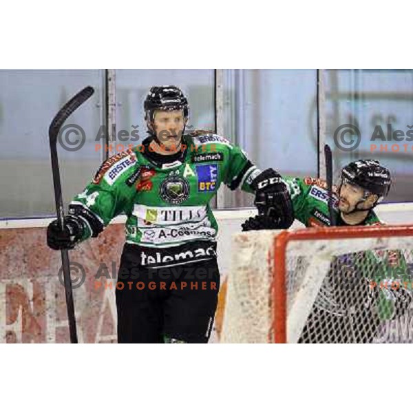 Jeff Ulmer, Andrej Hebar of Telemach Olimpija in action during ice-hockey match Telemach Olimpija- TWK Innsbruck in round 13 of Ebel league 2013/2014, played in Hala Tivoli, Ljulbjana, Slovenia on October 19,2013 