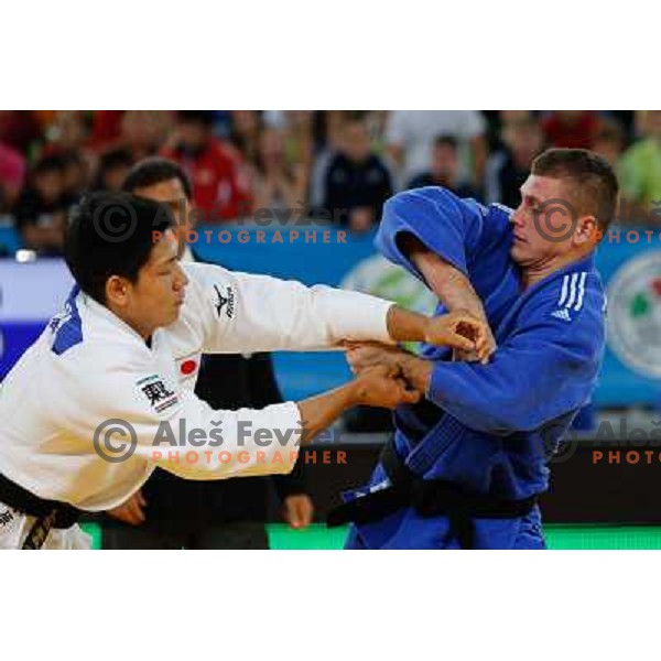 Primoz Marincic of Slovenia and Kenya Kohara of Japan in action during Judo World Championships Juniors in Arena Stozice, Ljubljana, Slovenia on October 27, 2013 