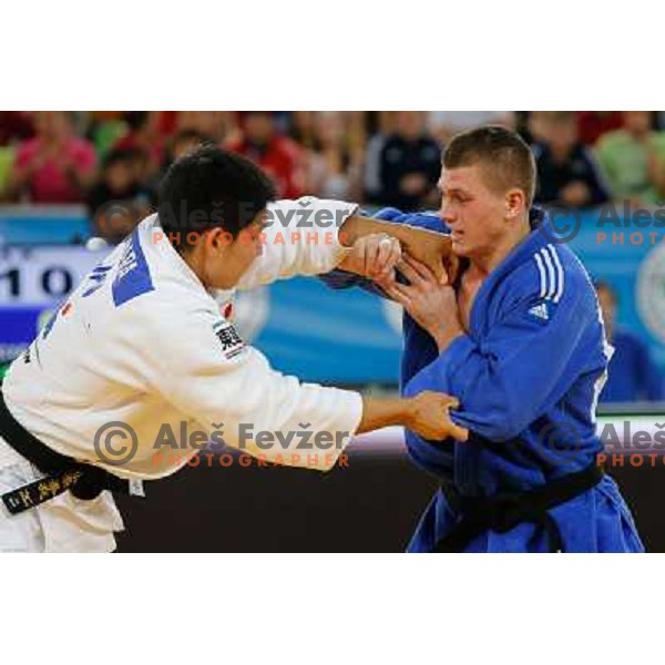 Primoz Marincic of Slovenia and Kenya Kohara of Japan in action during Judo World Championships Juniors in Arena Stozice, Ljubljana, Slovenia on October 27, 2013 