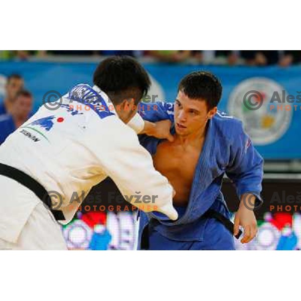 Tadej Dragic of Slovenia and Yusuke Kobayashi of Japan in action during Judo World Championships Juniors in Arena Stozice, Ljubljana, Slovenia on October 27, 2013 