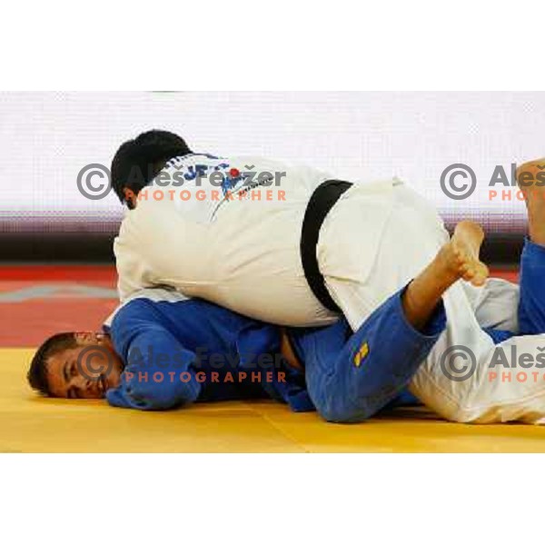 Vito Dragic of Slovenia and Isao Kurahashiof Japan in action during Judo World Championships Juniors in Arena Stozice, Ljubljana, Slovenia on October 27, 2013 