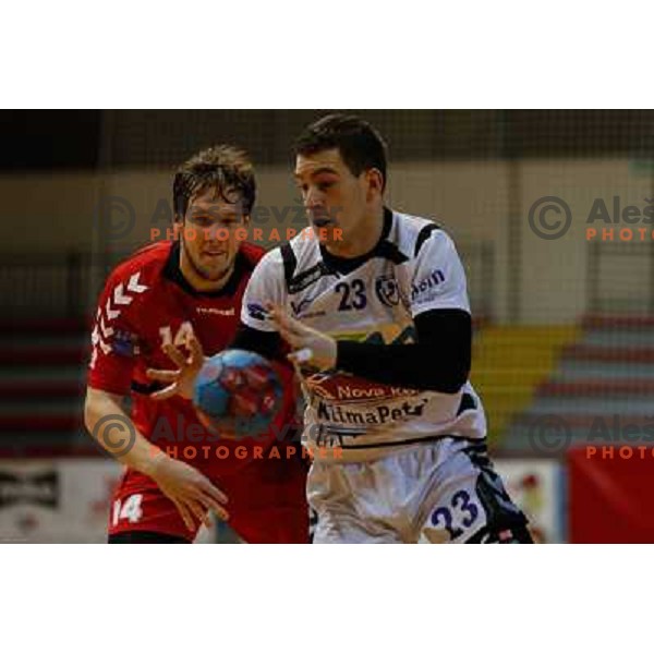 Andraz Kete of Slovan and Miha Zarabec of Maribor Branik in action during handball match between RD Slovan and RK Maribor Branik, played in Kodeljevo Hall, Ljubljana, Slovenia on October 27, 2013 
