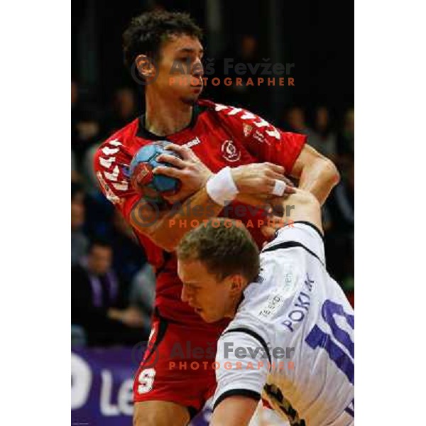 Jure Dobelsek of Slovan and Tine Poklar of Maribor Branik in action during handball match between RD Slovan and RK Maribor Branik, played in Kodeljevo Hall, Ljubljana, Slovenia on October 27, 2013 