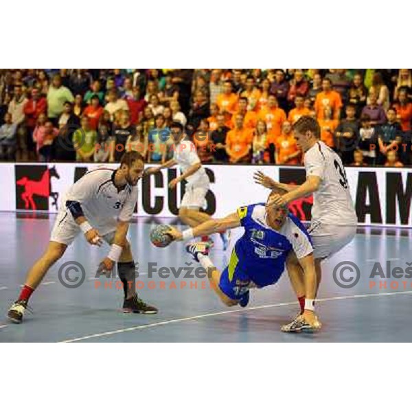 Miha Zvizej of Slovenia in action during handball match Slovenia-Switzerland in qualification for Qatar World Championships, played in Red Hall, Velenje, Slovenia on October 30 ,2013 