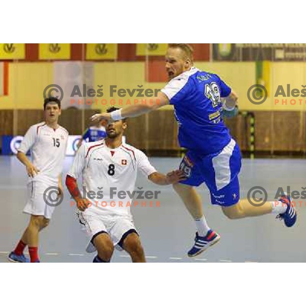 Miha Zvizej of Slovenia in action during handball match Slovenia-Switzerland in qualification for Qatar World Championships, played in Red Hall, Velenje, Slovenia on October 30 ,2013 