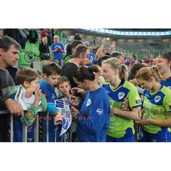 Fans of Krim Mercator meet players of Krim Mercator at handball match Krim Mercator- Leipzig in EHF Women\'s Champions league, played in Arena Stozice, Ljubljana, Slovenia on November 16, 2013 