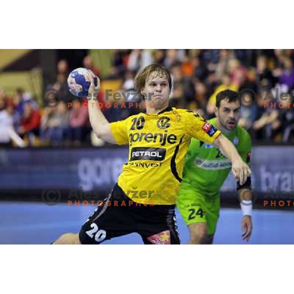 Stas Skube of Gorenje Velenje in action during EHF Champions league handball match between Gorenje Velenje ( SLO) and La Rioja (ESP) in Red hall, Velenje, Slovenia on november 23,2013 