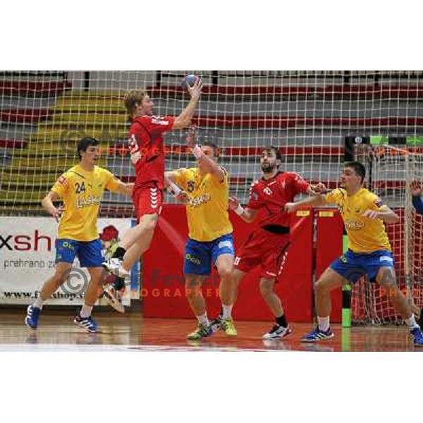 Nemanja Zelenovic of Celje Pivovarna Lasko and Miha Tomsic of Slovan in action during handball match Slovan - Celje PL. in 1. NLB leasing liga, played in Kodeljevo Hall, Ljubljana, Slovenia on November 27, 2013 