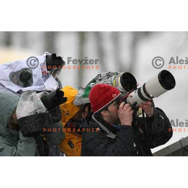 Photographers working in snow storm in Planica