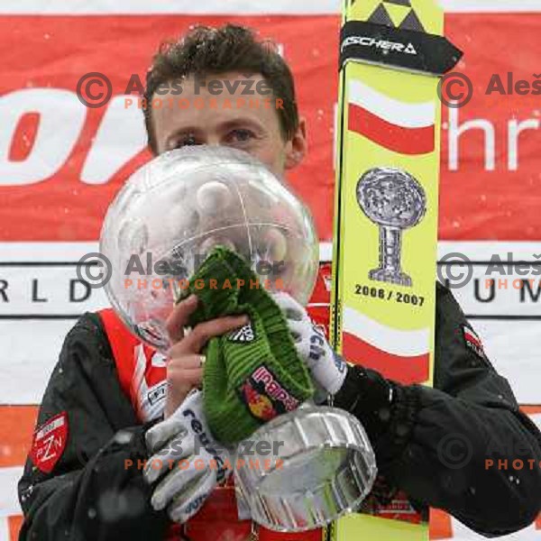 Malysz with World cup trophy for overall winner in 2006-2007 season