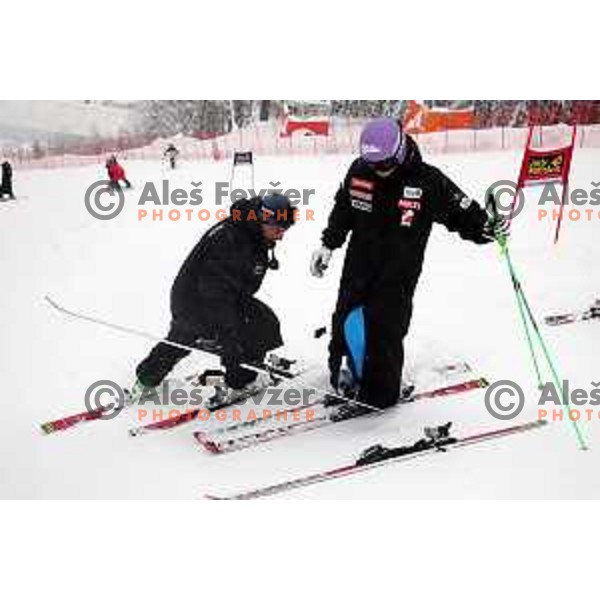Tina Maze of Slovenia and service man Andrea Vianello during course inspection at AUDI FIS World Cup Giant slalom for 50. Zlata Lisica- Golden Fox Trophy in Kranjska gora, Slovenia on February 1, 2014. Race was cancelled due to poor visibility