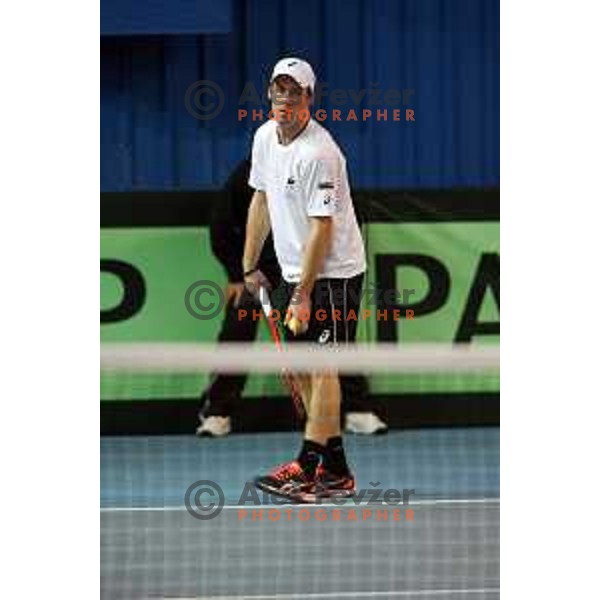 Grega Zemlja of Slovenia in action during doubles match in Davis Cup Slovenia-Portugal in Kranj, Slovenia on February 1, 2014