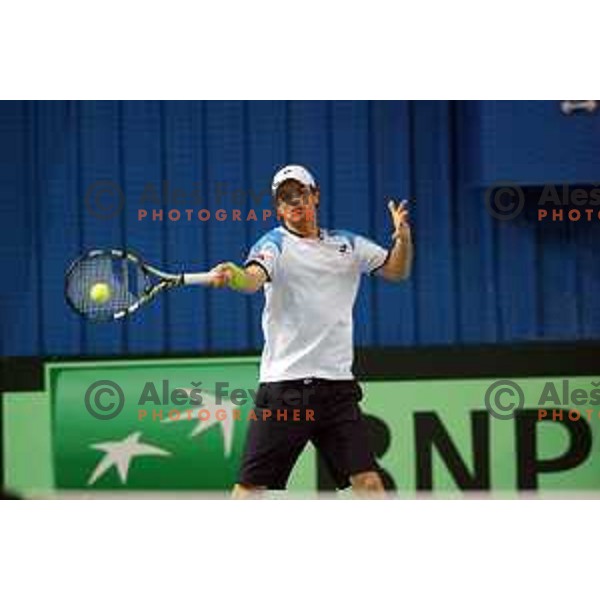 Blaz Kavcic of Slovenia in action during doubles match in Davis Cup Slovenia-Portugal in Kranj, Slovenia on February 1, 2014