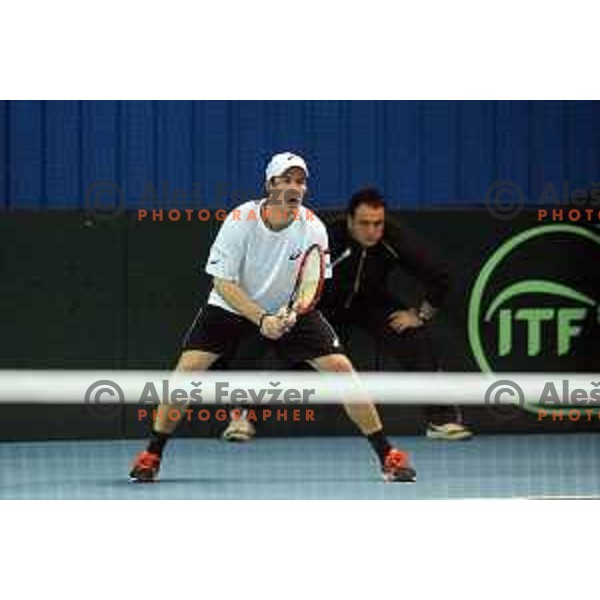Grega Zemlja of Slovenia in action during doubles match in Davis Cup Slovenia-Portugal in Kranj, Slovenia on February 1, 2014