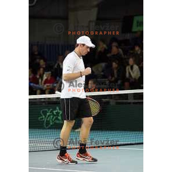 Grega Zemlja of Slovenia in action during doubles match in Davis Cup Slovenia-Portugal in Kranj, Slovenia on February 1, 2014