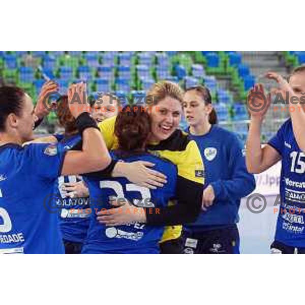 Players of Krim Mercator celebrate victory at handball match Krim Mercator (SLO) - Larvik (NOR) in EHF Women\'s Champions league, played in Arena Stozice, Ljubljana, Slovenia on February 1, 2014