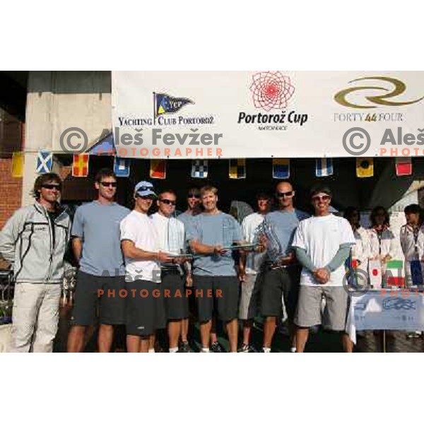 Team Aqua with trophies for winning fleet race, match race and overall ranking in sailing regatta for RC 44 Portoroz Cup in Pororoz,Slovenia.Photo by Ales Fevzer 