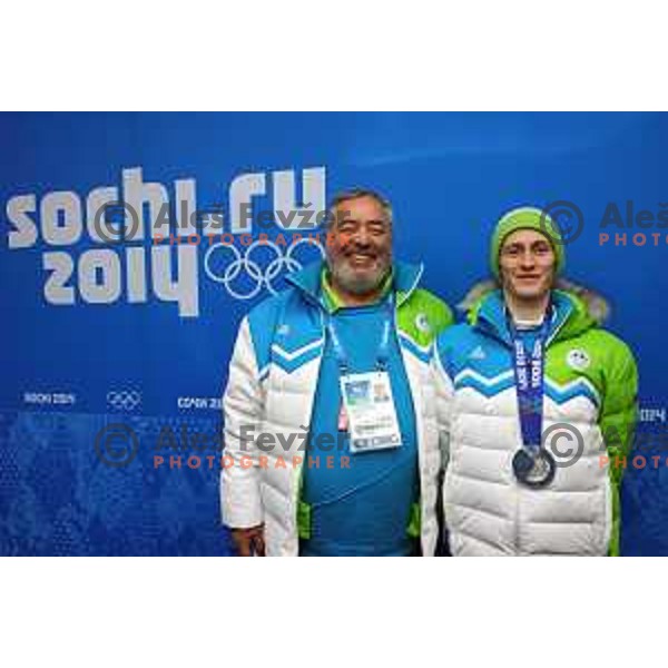 Brane Dmitrovic and Peter Prevc of Slovenia, olympic silver medalist in Ski jumping on Normal Hill at Sochi 2014 Winter Olympic Games in Olympic Park on February 10, 2014