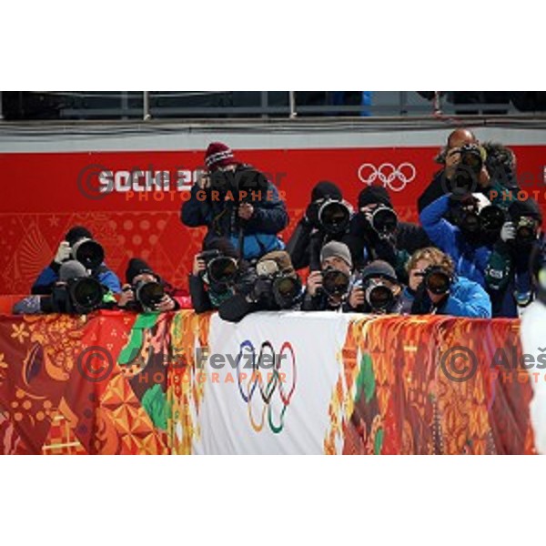 Photographers at Ladies Normal Hill ski jumping competition in RusSki Gorki, Sochi 2014 Winter Olympic games, Russia on February 11,2014