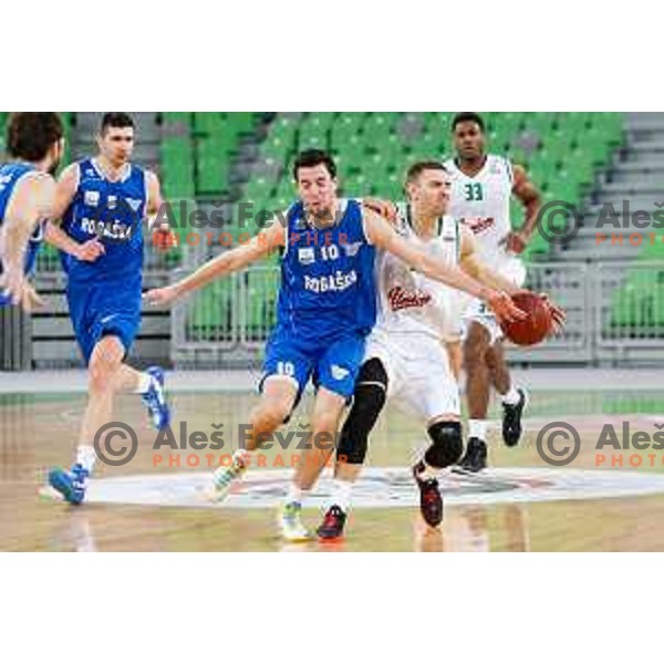 Deividas Gailius of Union Olimpija and Mitja Nikolic in action during basketball match between Union Olimpija and Rogaska of Telemach Leauge, played in Arena Stozice, Ljubljana, Slovenia on March 19, 2014