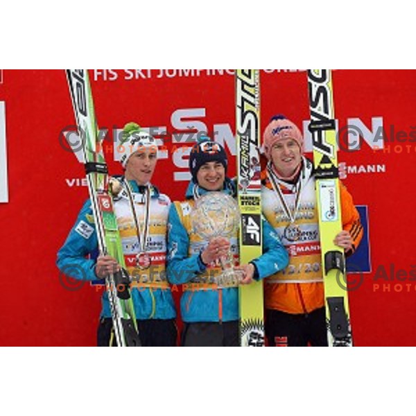 Peter Prevc of Slovenia, second place overall World Cup 2013/2014 season, winner Kamil Stoch of Poland and Severin Freund (GER) third placed in Planica, Slovenia on March 23,2014