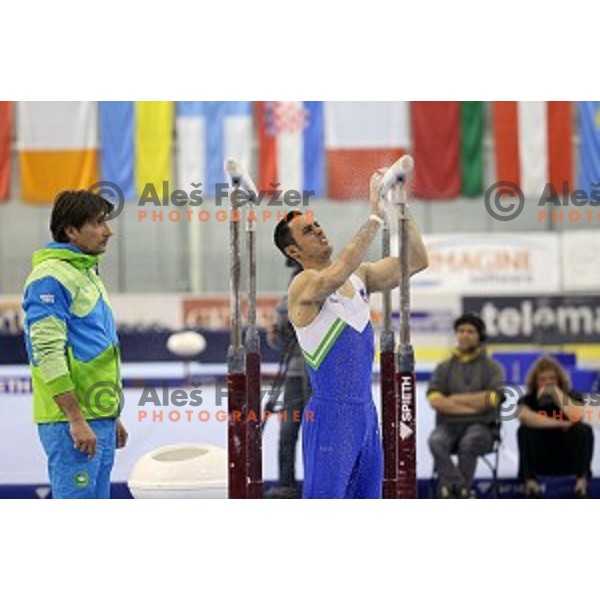 Coach Edvard Kolar and Alen Dimic of Slovenia before start of Parallel Bars during Artistic Gymnastics World Challenge Cup in Hala Tivoli, Ljubljana, Slovenia on April 20, 2014