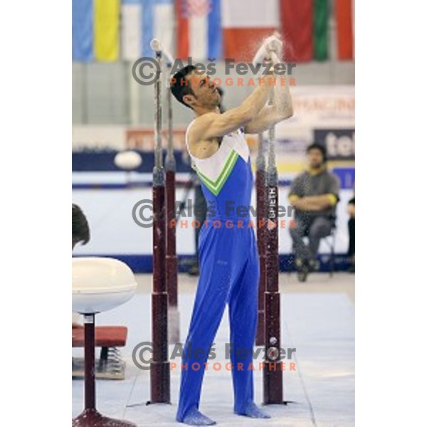 Alen Dimic of Slovenia competing at Parallel Bars during Artistic Gymnastics World Challenge Cup in Hala Tivoli, Ljubljana, Slovenia on April 20, 2014