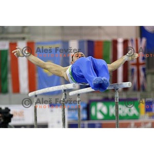 Alen Dimic of Slovenia competing at Parallel Bars during Artistic Gymnastics World Challenge Cup in Hala Tivoli, Ljubljana, Slovenia on April 20, 2014