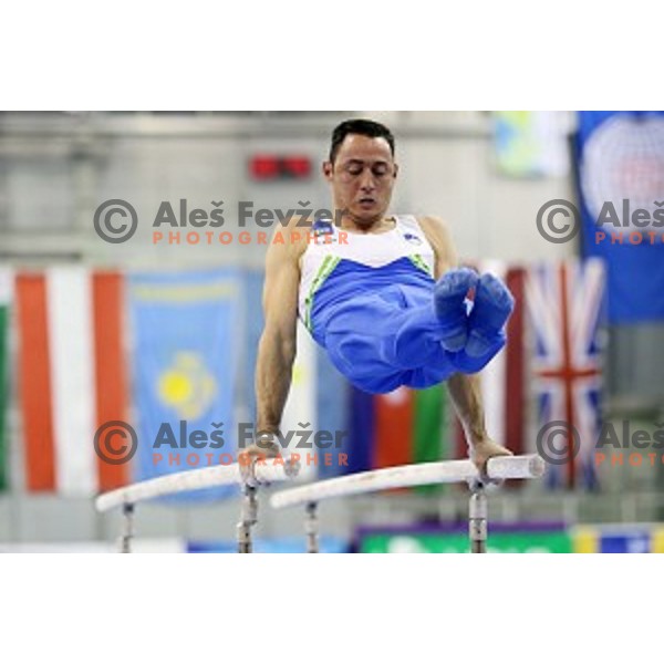 Alen Dimic of Slovenia competing at Parallel Bars during Artistic Gymnastics World Challenge Cup in Hala Tivoli, Ljubljana, Slovenia on April 20, 2014